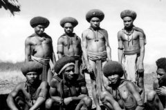 Men at Ruti, Lower Jimi River (probably from the Schrader range between the Ramu and Jimi rivers) - said to have journeyed to see the airstrip under construction in the lower Jimi